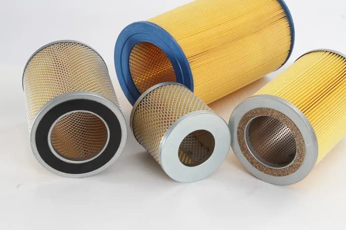 Cylindrical air filter elements with perforated liners